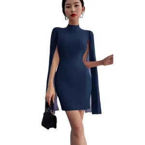 Elegant navy blue rib-knit bodycon mini dress featuring chiffon cape and pearl accents.