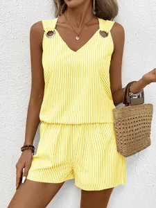 Detail of yellow striped tank top with metal rings and high-waist shorts set