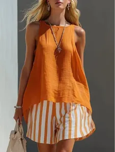 Chic casual summer cotton linen set featuring orange sleeveless top and striped shorts detail
