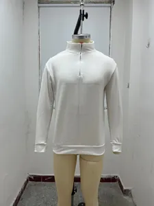 Detailed view of a white long-sleeved men's leisure half-zip pullover on a mannequin
