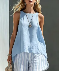 Model wearing a light blue sleeveless cotton linen top and striped casual shorts