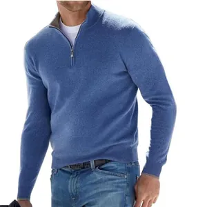 Detail of men's blue quarter-zip wool sweater with a soft texture and standing collar.