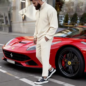 Premium off-white corduroy half-zip tracksuit for men shown in urban lifestyle