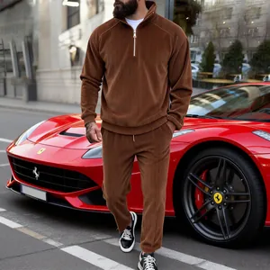 Detail view of brown corduroy men's half-zip tracksuit set with ribbed texture