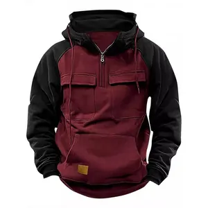 Front view of men's retro color block hoodie in maroon and black with dual chest pockets