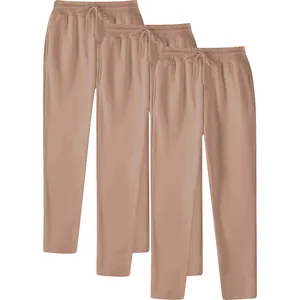 Set of three men's solid color straight-leg sweatpants in tan with drawstring waist