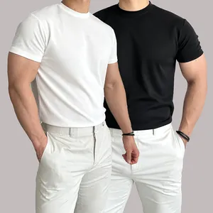 Detail view of men's athletic slim fit crew neck T-shirts in white and black