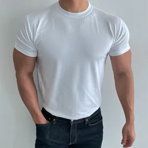 Close-up detail of a white athletic slim-fit training t-shirt on a muscular male model