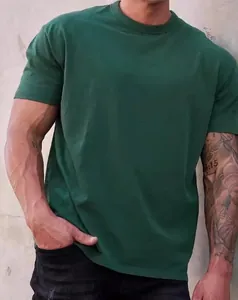 Detailed view of dark green short sleeve crew neck t-shirt on athletic male model