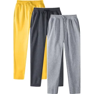 Detailed view of three pairs of men's casual fleece sweatpants in various colors