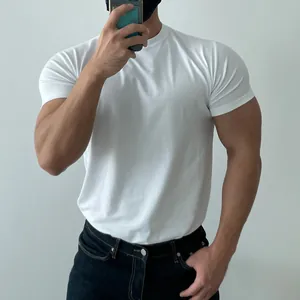 Close-up of men's muscle fit white T-shirt showing tight athletic cotton fabric details