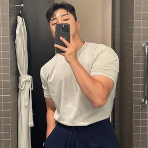 Close-up of a men's athletic crew neck short sleeve T-shirt in light grey with slim fit