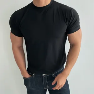 Close-up of men's slim-fit athletic black t-shirt for fitness and training