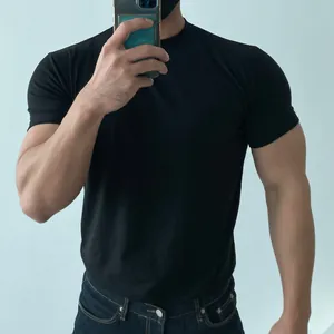Muscle fit black training t-shirt for men showing athletic physique and fabric details