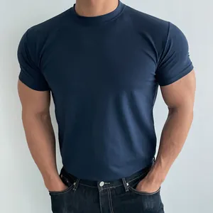 Slim fit men's athletic T-shirt in navy blue, close-up view of premium breathable fabric