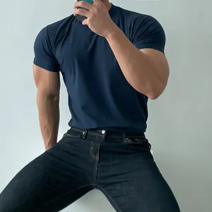 Close-up detail of men's muscle fit navy blue athletic gym T-shirt with high elasticity