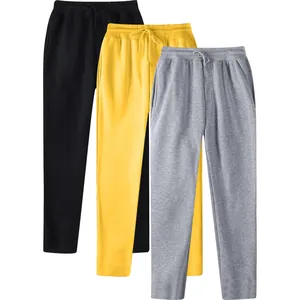 Three-piece set of solid color men's fleece-lined sweatpants in black, yellow, and grey