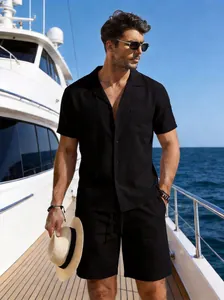 Detailed shot of men's black linen shirt and shorts set on a luxury boat
