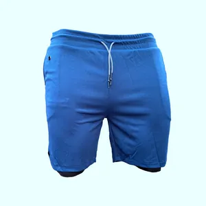 Vue détaillée du short de course 2-en-1 bleu pour homme avec taille élastique à cordon