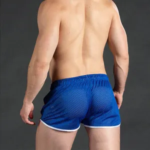 Detail view showing the back fit and mesh texture of blue men's quick-dry athletic shorts