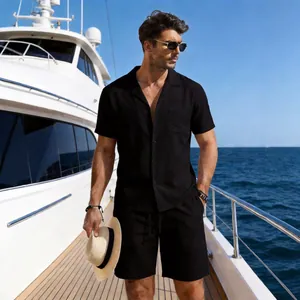 Casual men's black linen shirt and shorts set styled outdoors on a luxury yacht deck.
