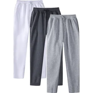 Three pairs of men's minimalist plain straight-leg sweatpants in white and gray tones.