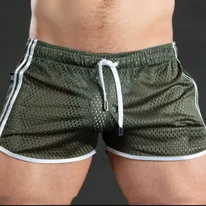 Detail view of army green mesh breathable quick-dry men's gym shorts with drawstring.