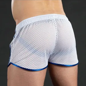 Macro detail of white breathable mesh athletic shorts for men with contrasting blue trim.