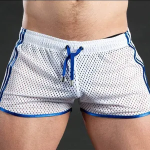 Close-up of white breathable mesh gym shorts with blue trim and drawstring detail