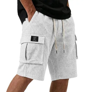 Comfortable men's white waffle knit cargo shorts featuring drawstring waist and large pockets
