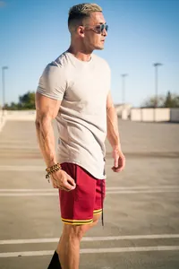 Detail of men's athletic cotton T-shirt in light grey for summer fitness style