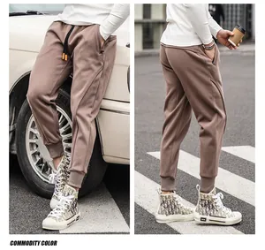 Casual men's American style jogger sweatpants with zipper pockets and tapered cuffed ankles
