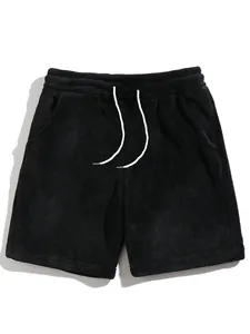 Detailed view of men's black coral fleece casual lounge shorts with white drawstring