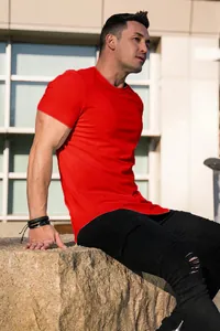 Close-up of a muscular man wearing a vibrant red crew neck short-sleeved cotton T-shirt