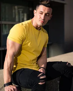 Close-up of a men's casual yellow cotton T-shirt with a stylish slim-fit design.