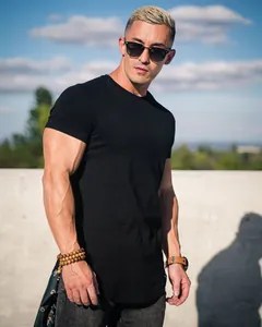 Detailed shot of men's plain black cotton short-sleeve T-shirt in athletic fit