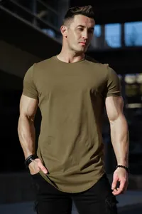 Olive green athletic fit cotton T-shirt with curved hem for men's casual street style