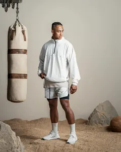 Men's breathable double-layer running shorts shown in a desert training scene