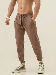 Men's brown American style athletic sweatpants with drawstring and joggers fit