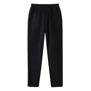 Front view detail of black men's straight casual sports trousers with drawstring waist