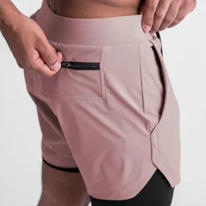 Close-up of functional zippered back pocket on men's pink double-layer sports shorts