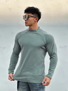 Macro view of a men's slim-fit long-sleeved muscle athletic t-shirt in grey-green