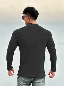 Close-up back view of men's slim-fit black thermal long sleeve muscle sports t-shirt