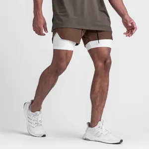 Detail shot of men's brown 2-in-1 athletic shorts with white compression liner.