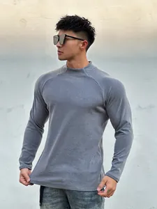 Detailed view of men's slim fit athletic long sleeve thermal shirt in heather grey