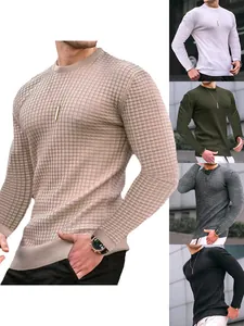 Detailed view of men's slim fit waffle knit long sleeve crew neck shirts in multi colors