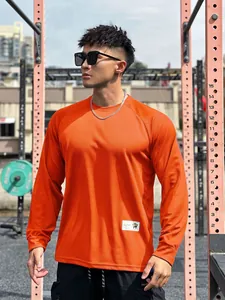 Detailed view of breathable orange mesh long sleeve athletic training T-shirt for men