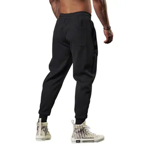Detailed rear view of men's black fleece-lined athletic joggers featuring ribbed cuffs