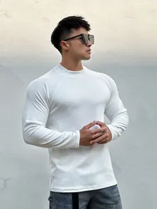 Detail view of men's slim-fit white thermal long-sleeve t-shirt with muscle-fit design