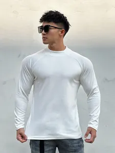 Close-up detail of slim fit white thermal long sleeve t-shirt on athletic male model